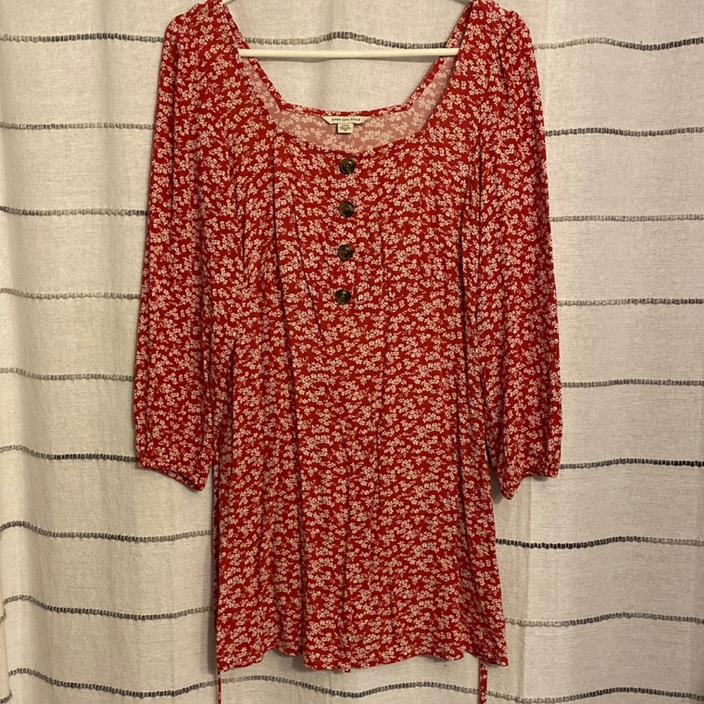 red quarter sleeve dress with white flower detail
